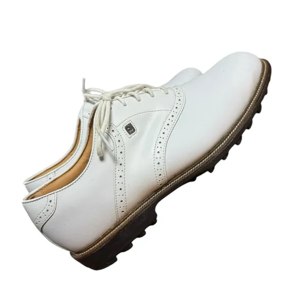 Foot joy, men’s size 10 W white golf shoes.