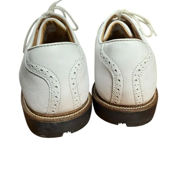 Foot joy, men’s size 10 W white golf shoes.