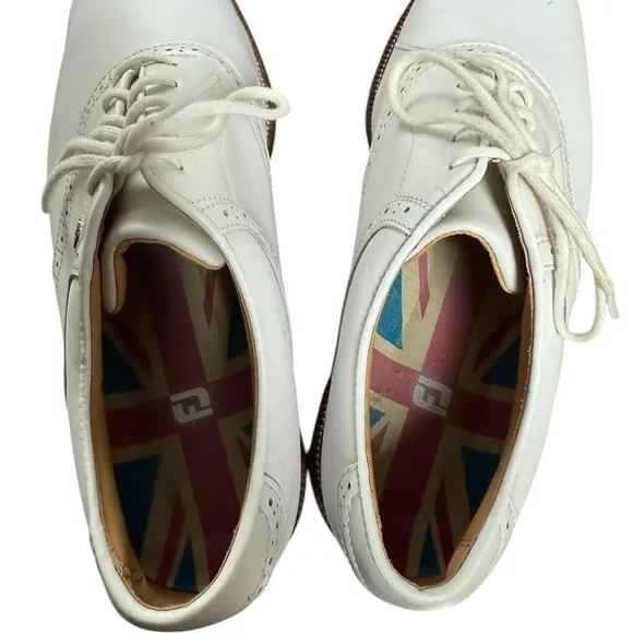 Foot joy, men’s size 10 W white golf shoes.