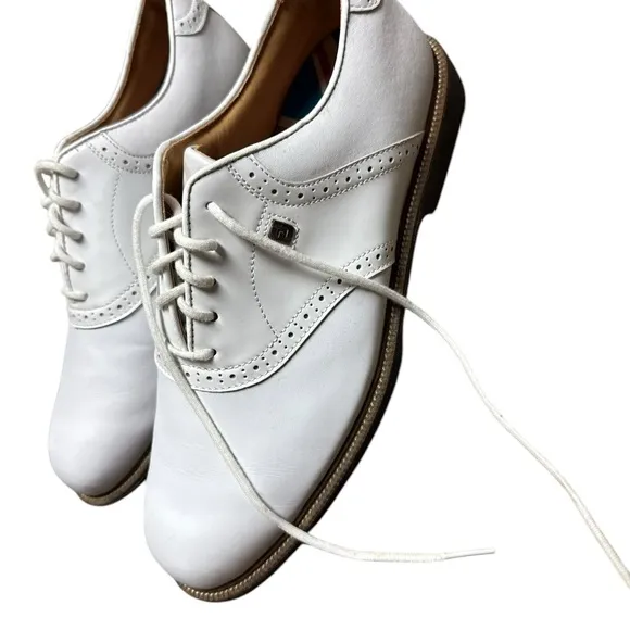Foot joy, men’s size 10 W white golf shoes.