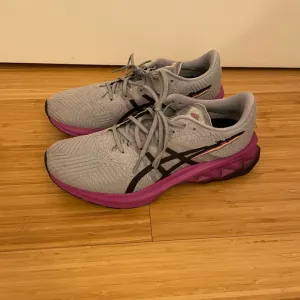Grey and purple ASICS running shoes