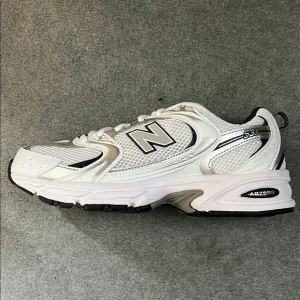 New Balance White, Black and Blue Running Sneakers