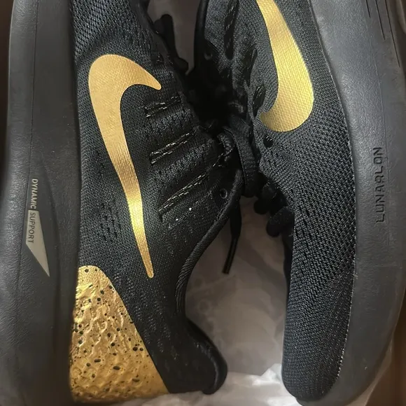 Nike gold and black uneasy running shoes