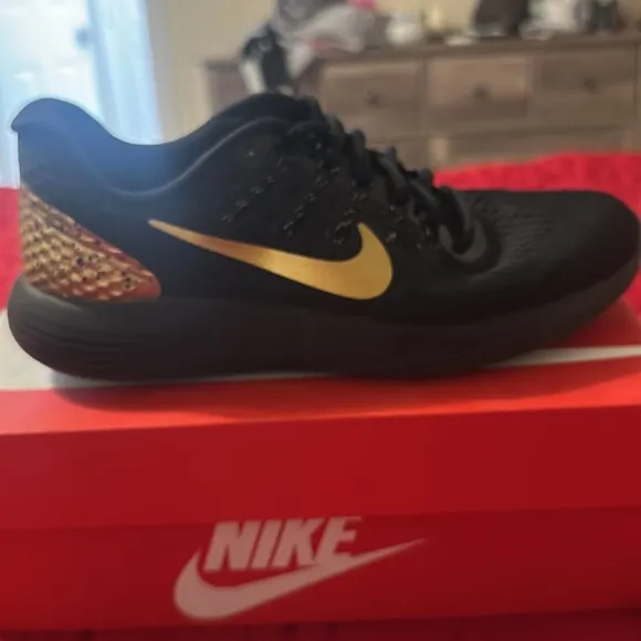 Nike gold and black uneasy running shoes