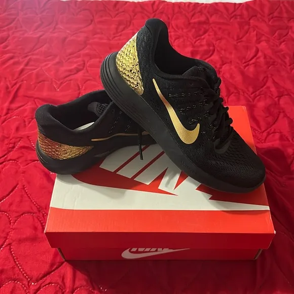 Nike gold and black uneasy running shoes